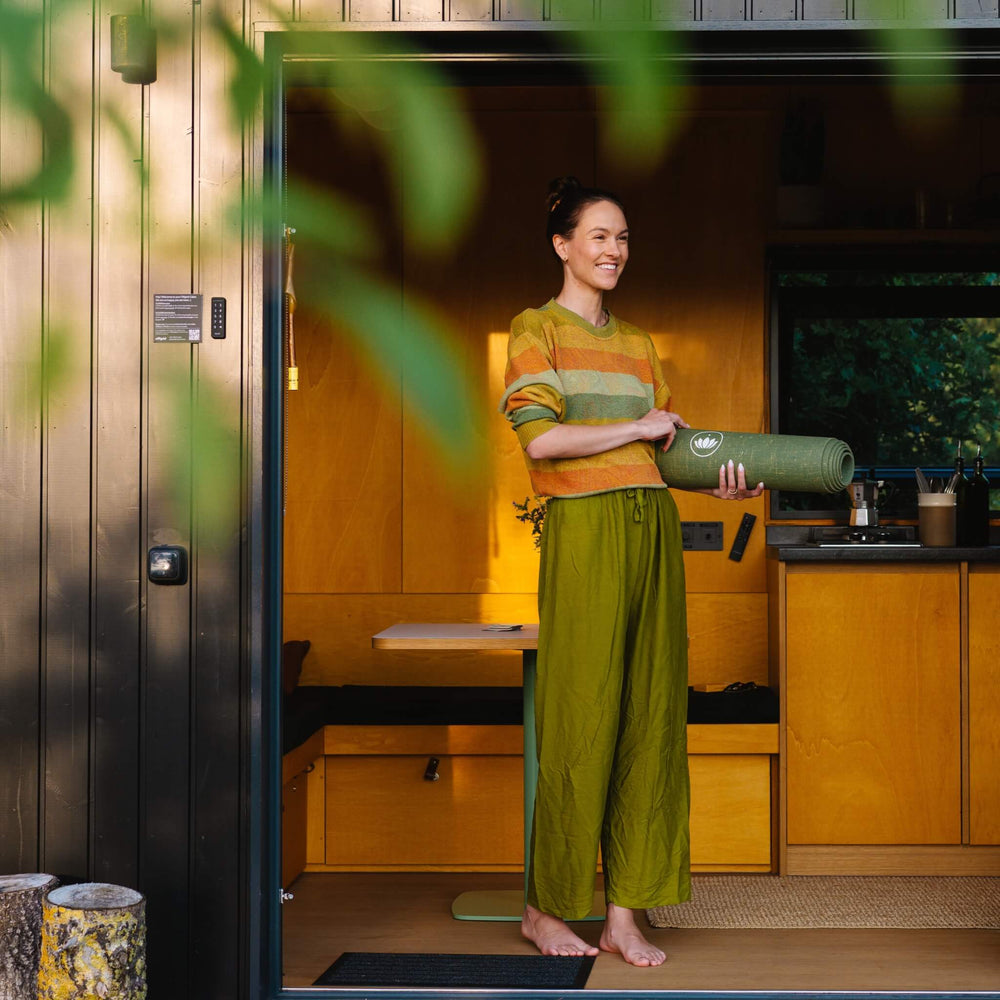 Yoga mat inside a cozy tiny house in Brandenburg surrounded by nature