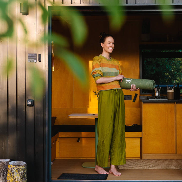 Yoga mat inside a cozy tiny house in Brandenburg surrounded by nature
